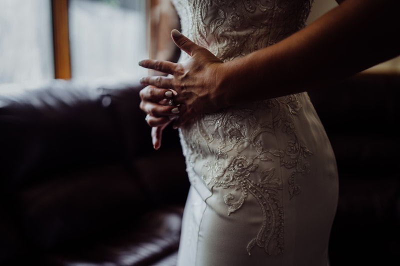 Bride wearing wedding ring before ceremony