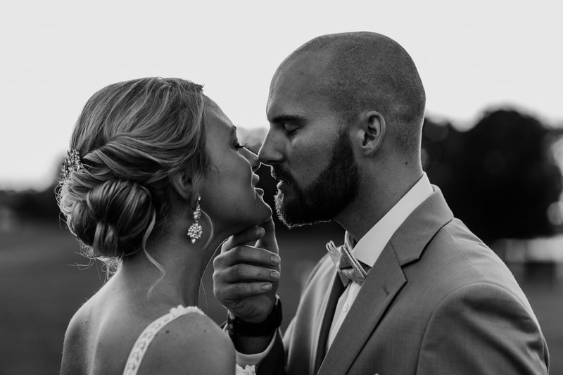 Black and white bride and groom about to kiss