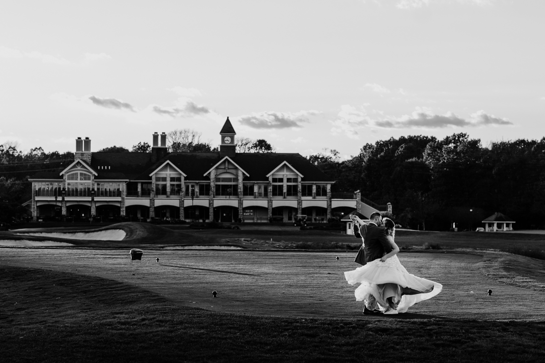 Couple dancing on golf course at Scotland Run Country Club